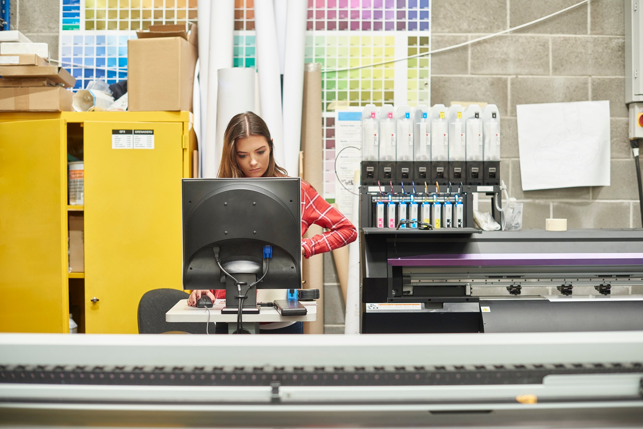 young woman working at a digital printing company